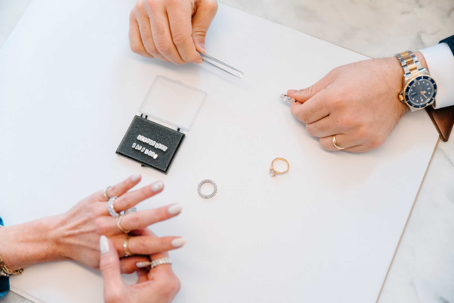 Examining jewelry with tweezers